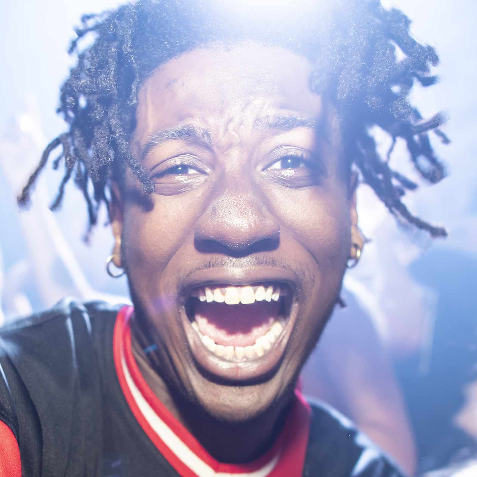 College-aged man with energetic expression at a nightclub in Tempe, Arizona