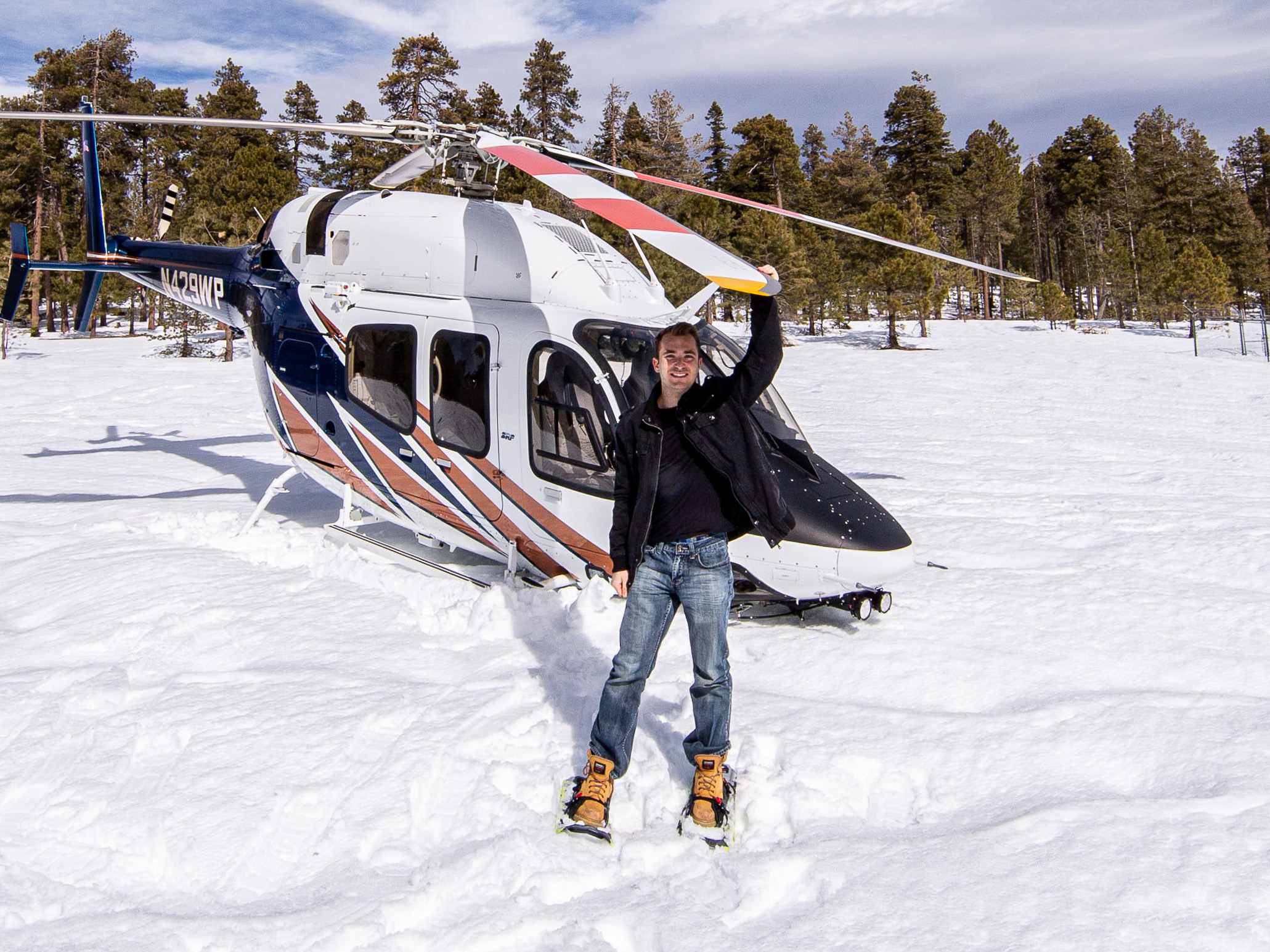 Billy Hardiman with Bell 429 helicopter in snow during aviation photoshoot