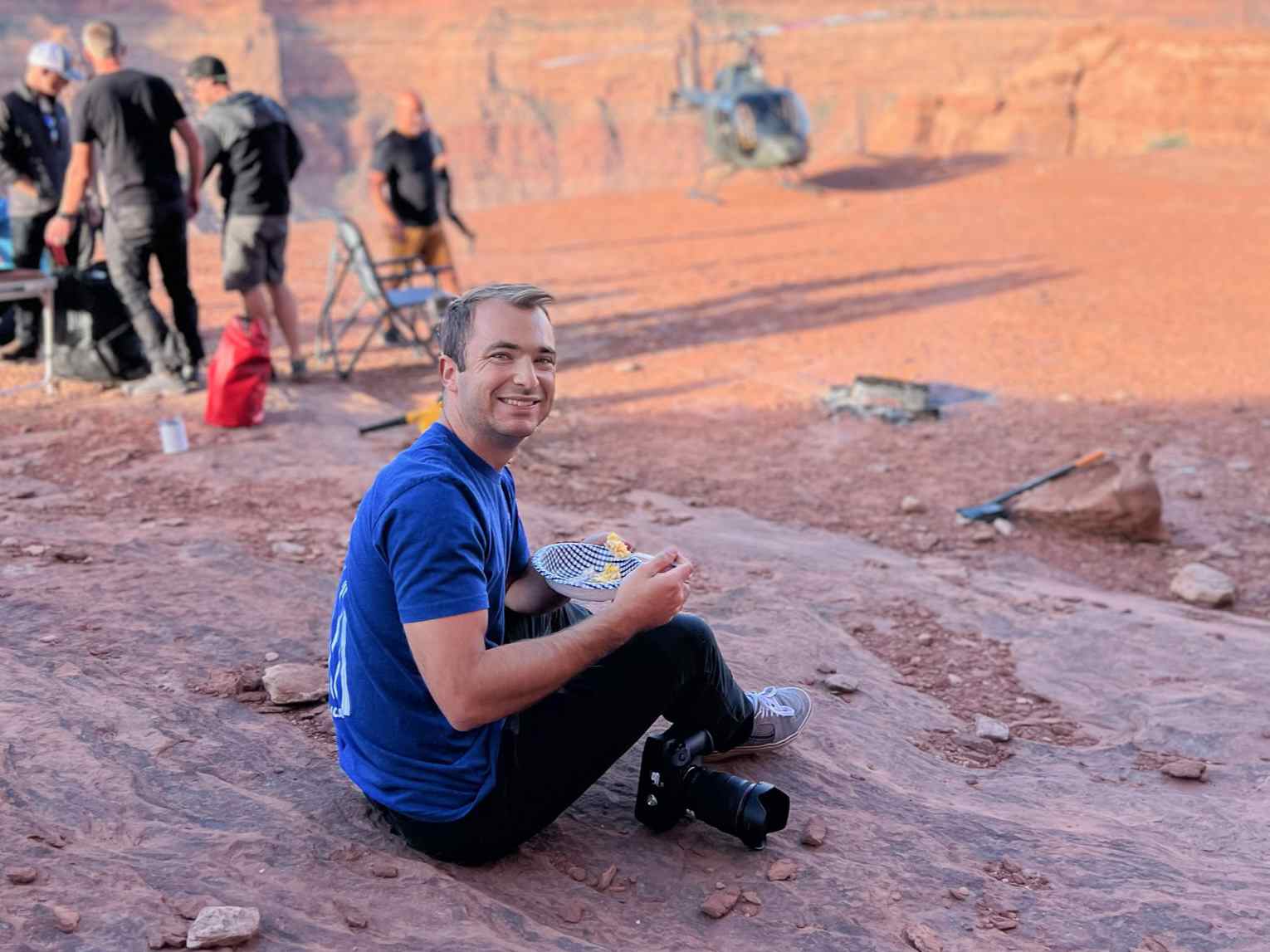 Billy Hardiman eating breakfast in Red Rock Wilderness during helicopter assignment