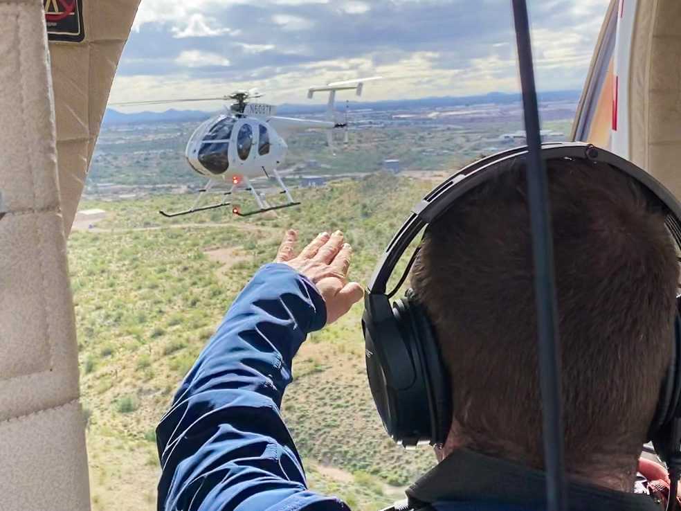 Billy Hardiman directing MD530F helicopter during air-to-air photoshoot near Phoenix