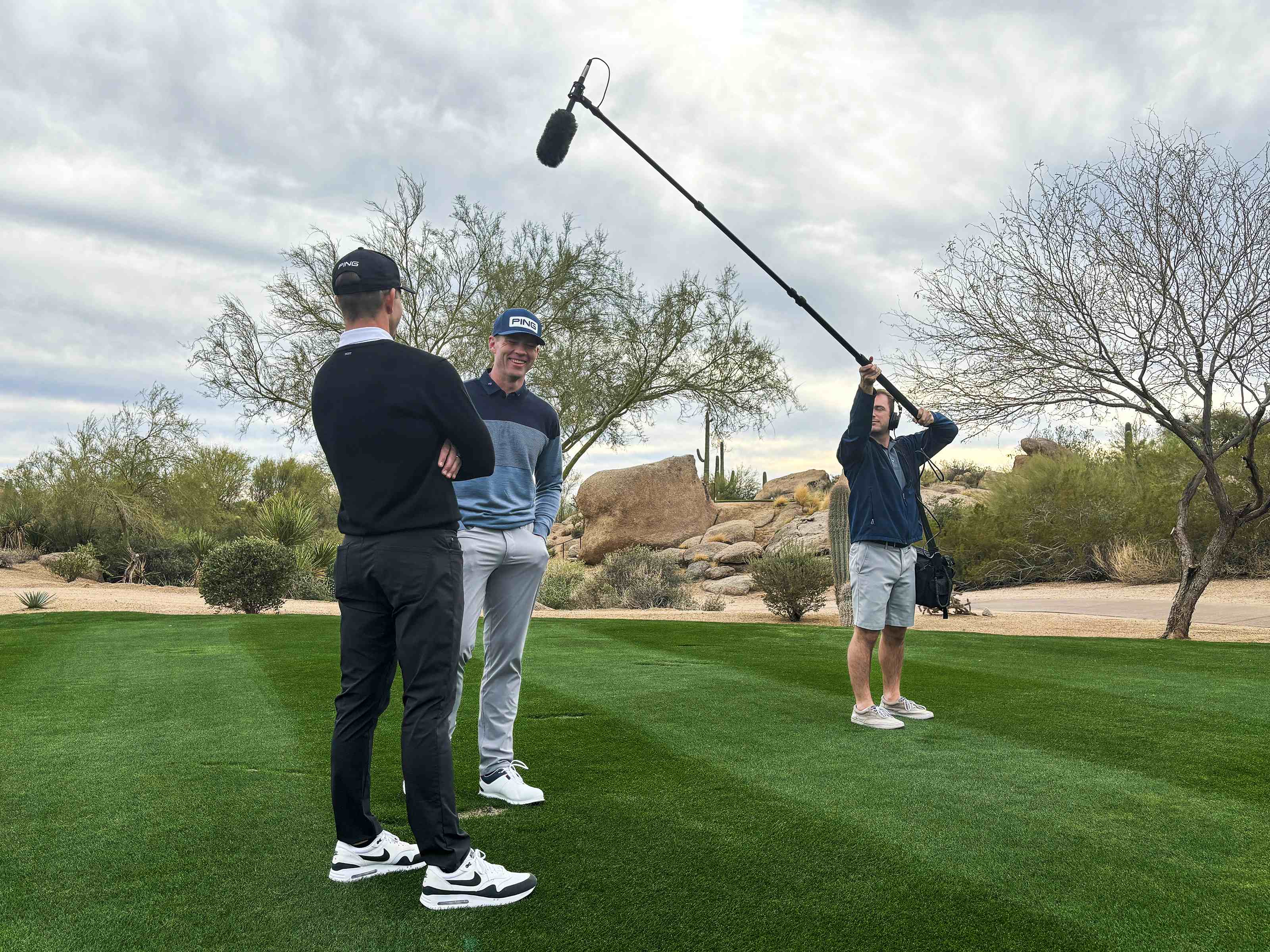 Billy Hardiman operating a boom microphone during an on-location recording session at The Estancia Club in Scottsdale